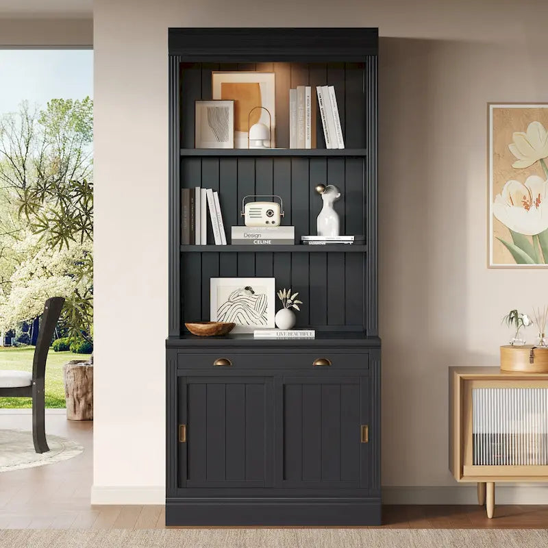 Tall Bookcase with LED Top Lighting 3 Open Shelves Center Drawer 2 Sliding Doors Beadboard Panels and Gold Semicircle Pulls